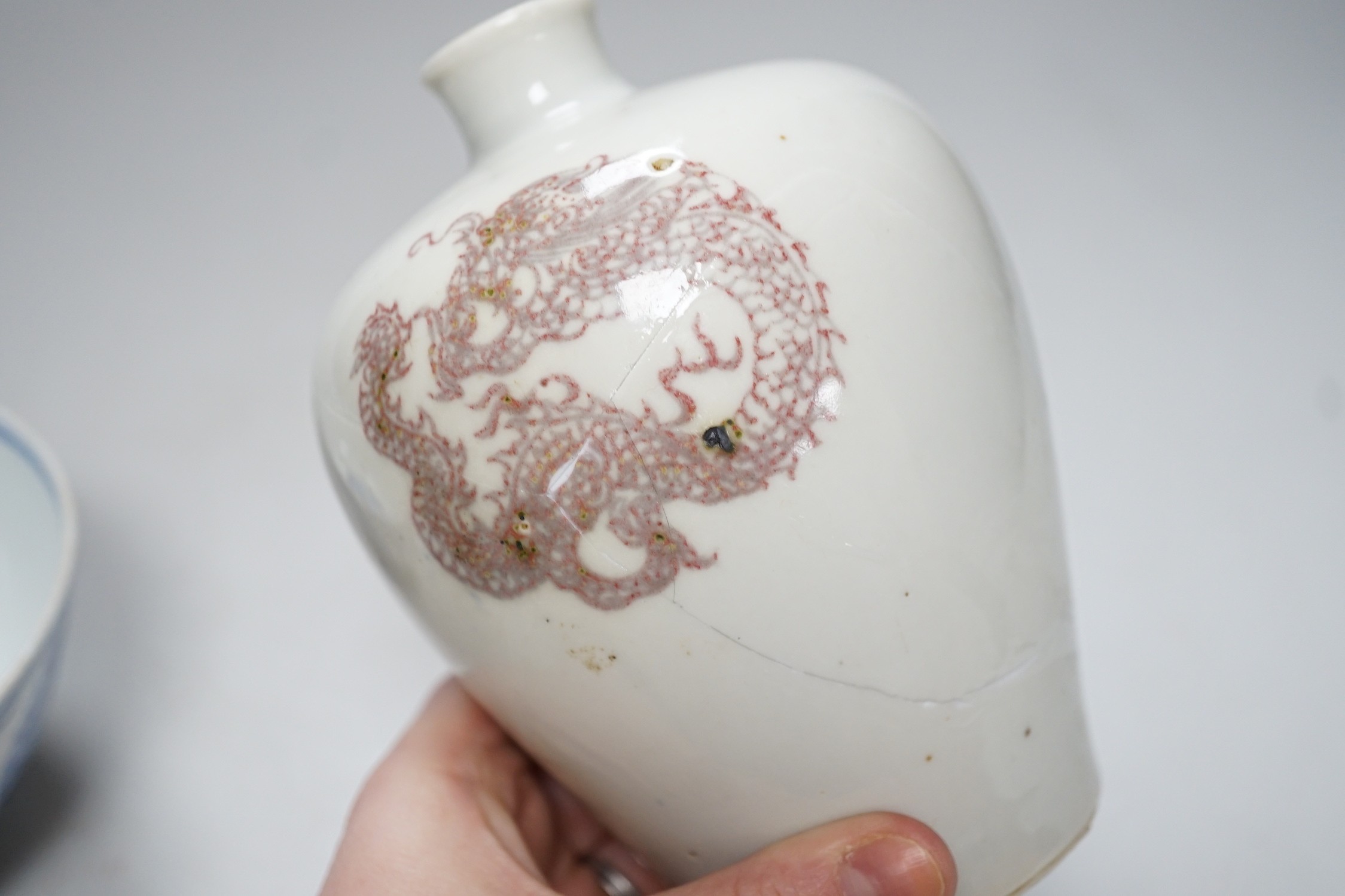 A Chinese underglaze copper red meiping a.f. and a Chinese blue and white bowl. Tallest 15cm